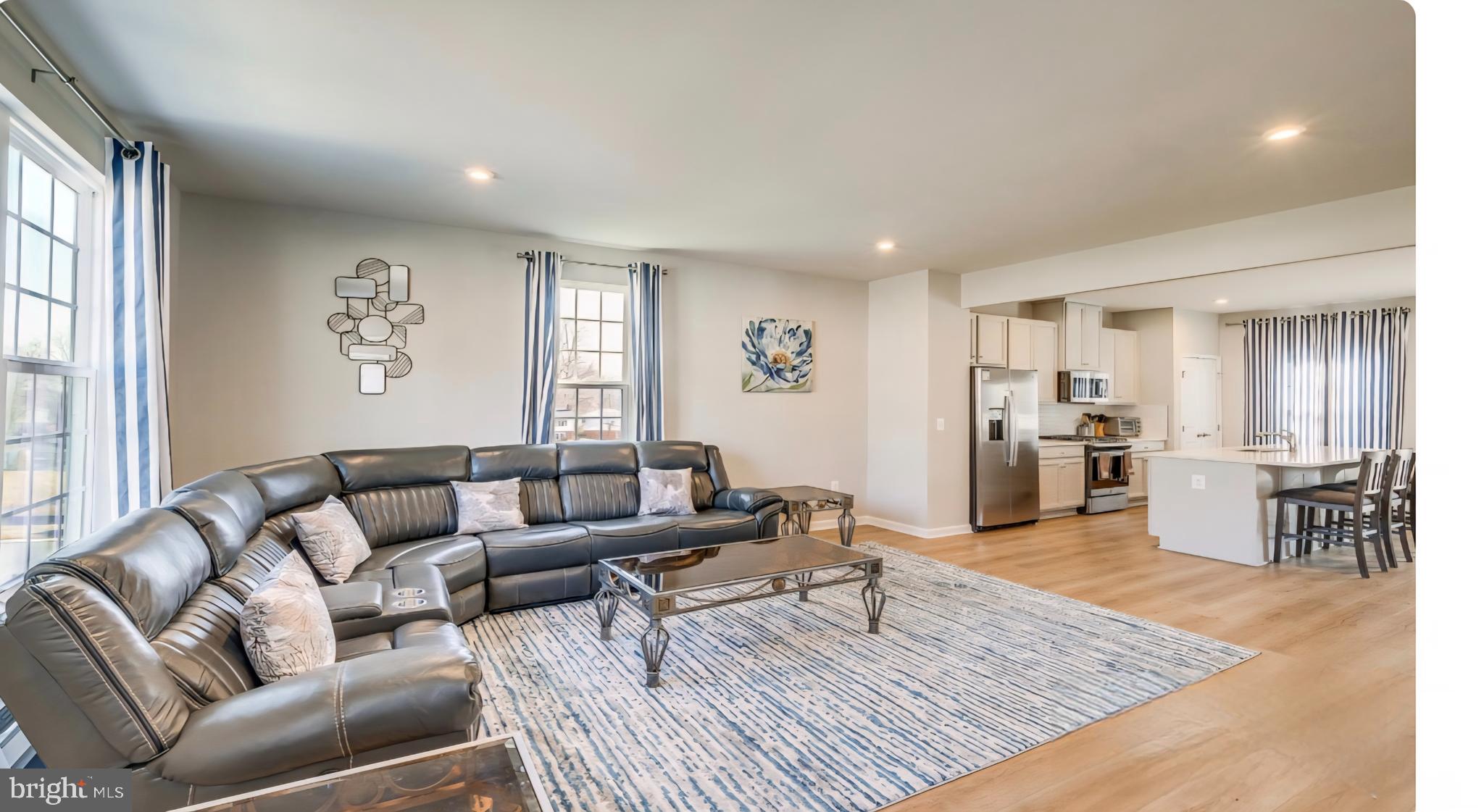 14489 Dolce Lane Woodbridge, VA 22193 - Photo 8 of 26 a living room with furniture and wooden floor