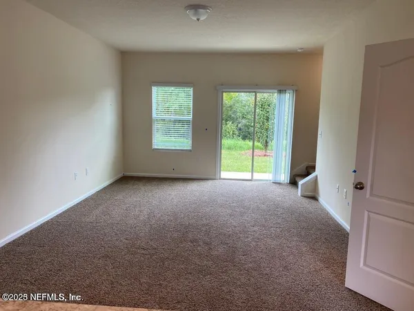 a view of a room that has a window in it