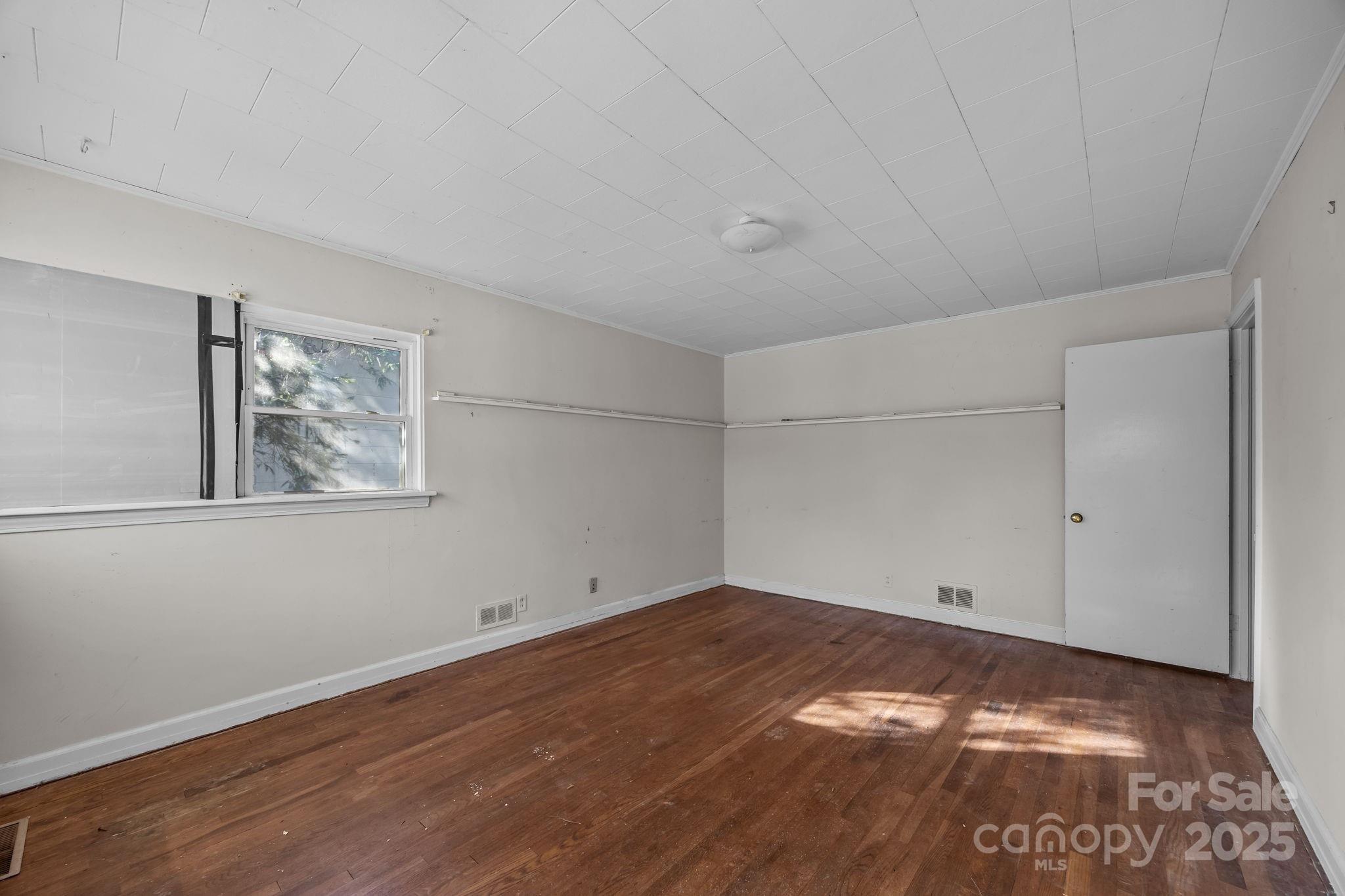 228 Grove Street Brevard, NC 28712 - Photo 11 of 44 a view of empty room with wooden floor
