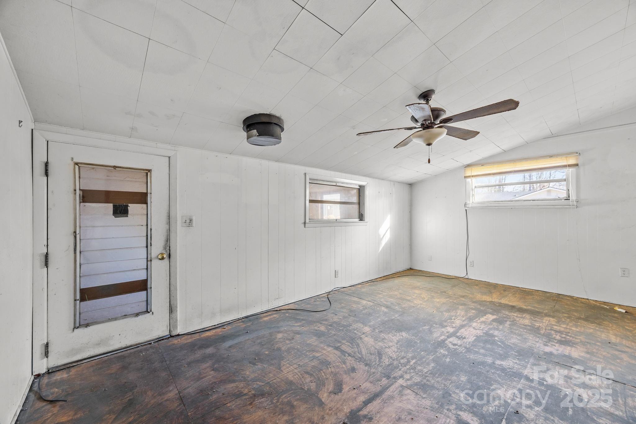 228 Grove Street Brevard, NC 28712 - Photo 21 of 44 an empty room with windows and fan