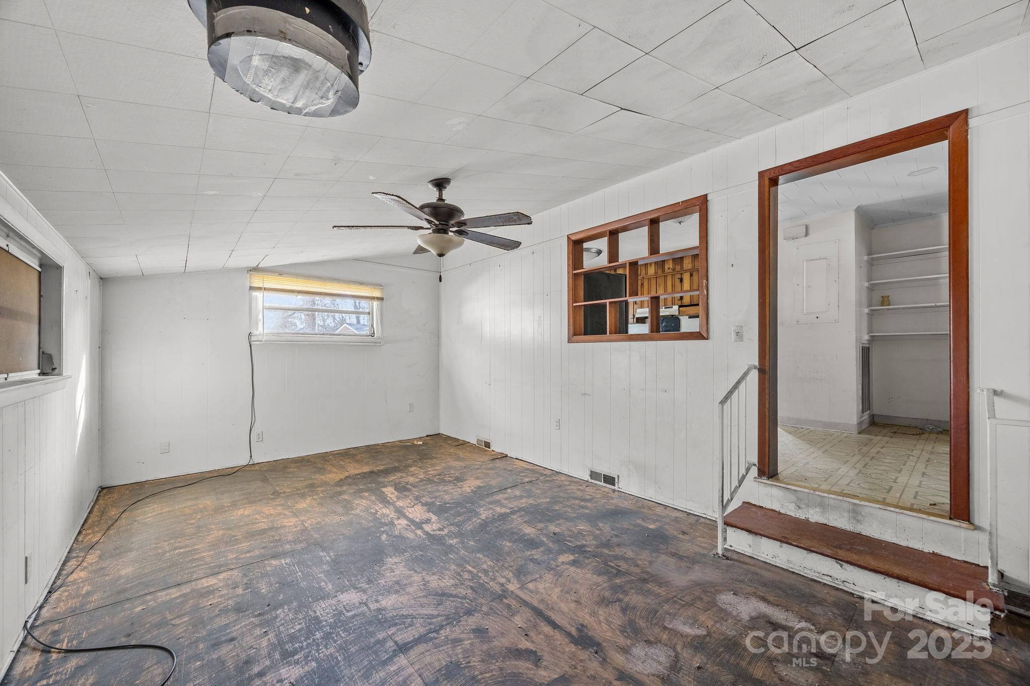 228 Grove Street Brevard, NC 28712 - Photo 22 of 44 a view of a room with a mirror and a fan