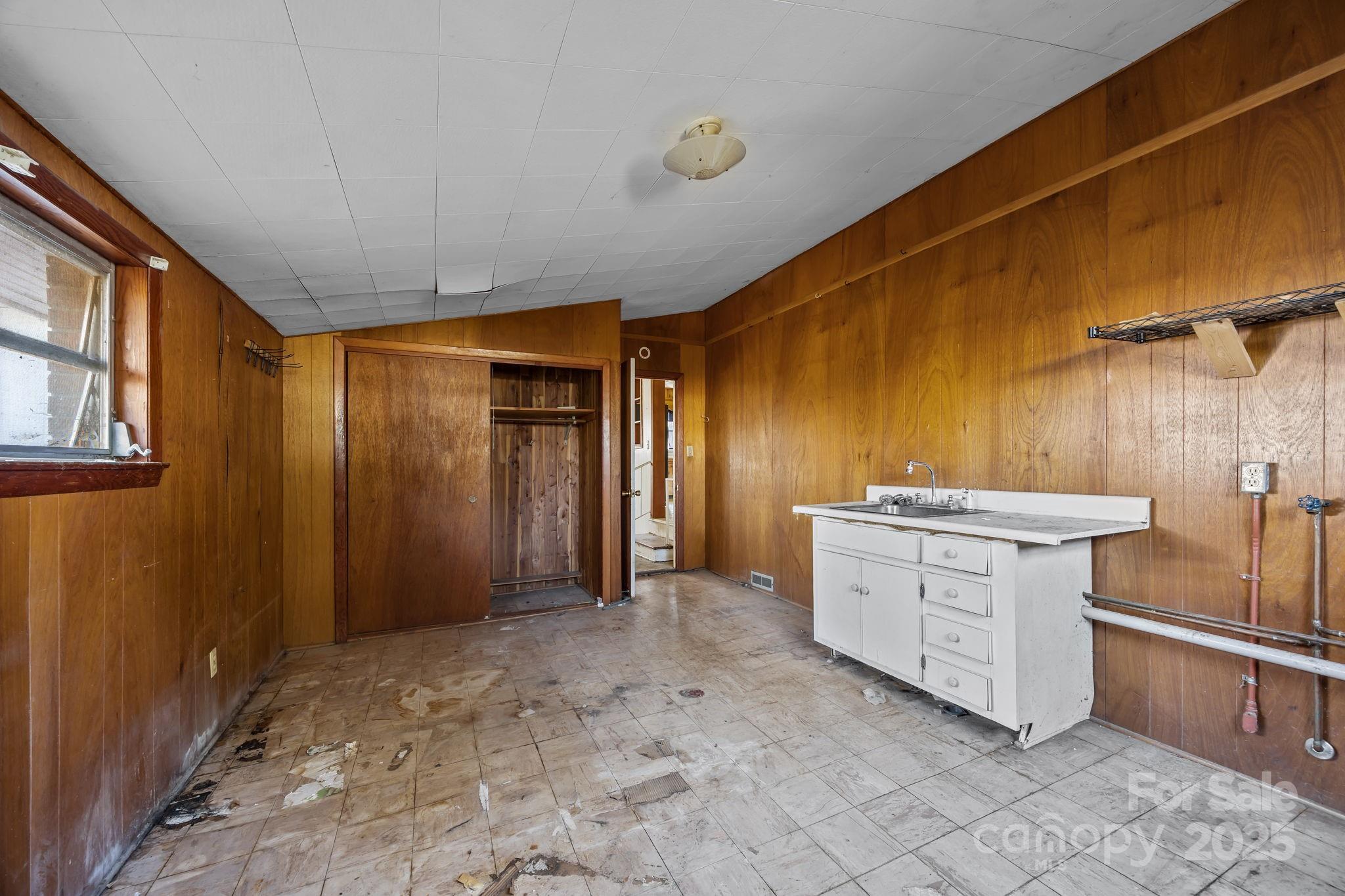 228 Grove Street Brevard, NC 28712 - Photo 25 of 44 a bathroom with a sink and a mirror
