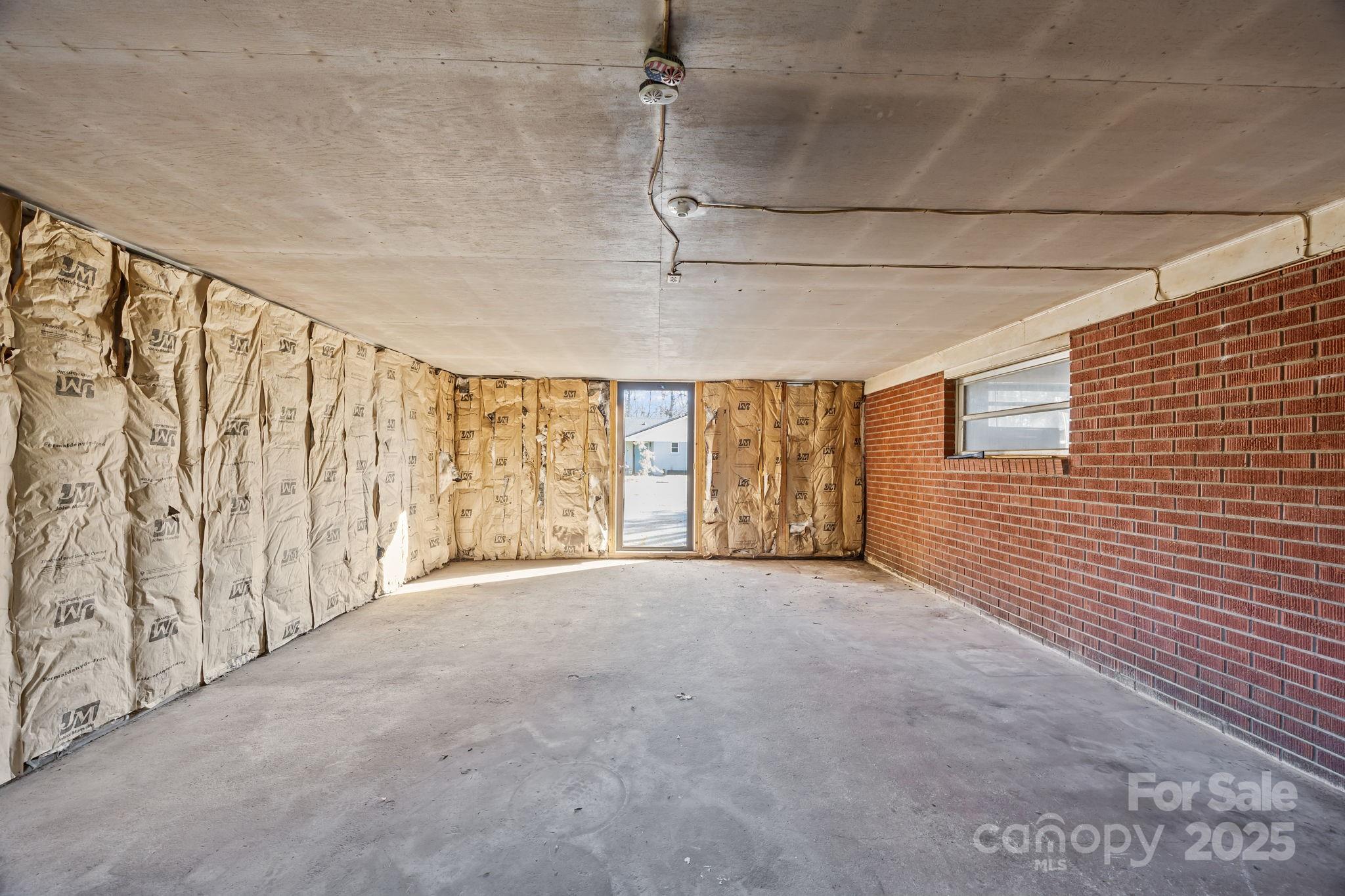 228 Grove Street Brevard, NC 28712 - Photo 33 of 44 a view of an empty room with a window