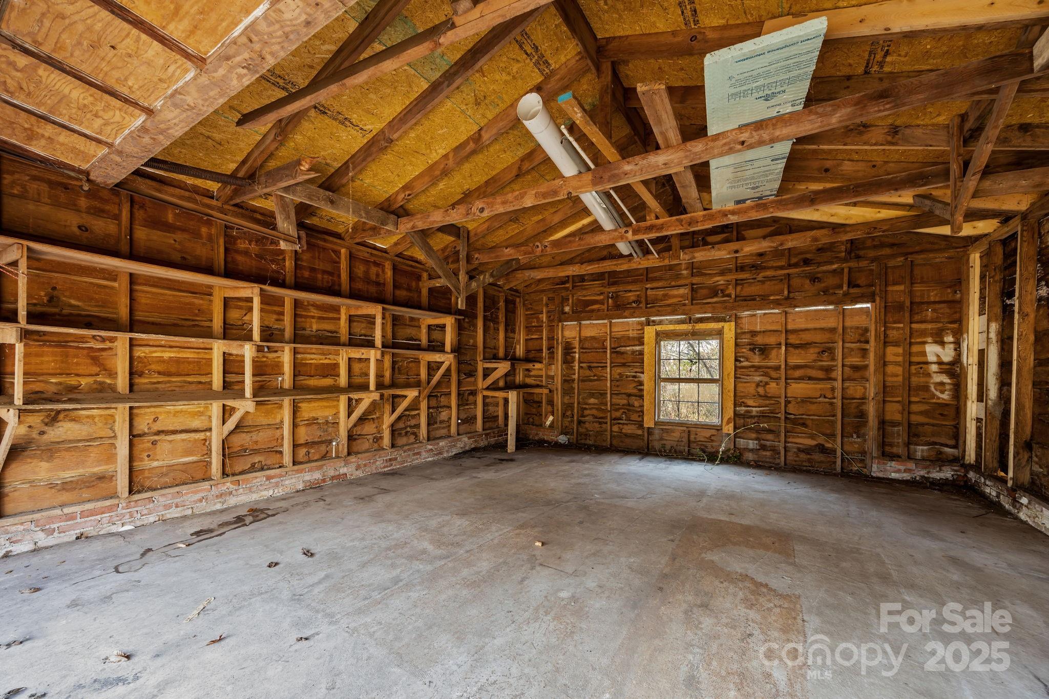 228 Grove Street Brevard, NC 28712 - Photo 40 of 44 a view of an empty room with wooden walls