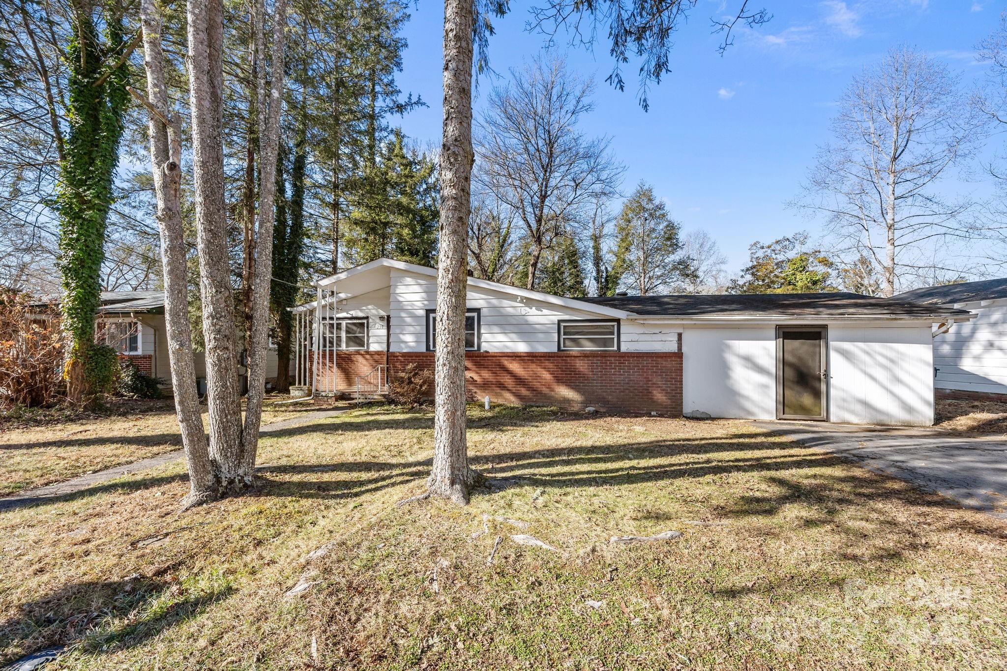 228 Grove Street Brevard, NC 28712 - Photo 5 of 44 a view of a house with a small yard