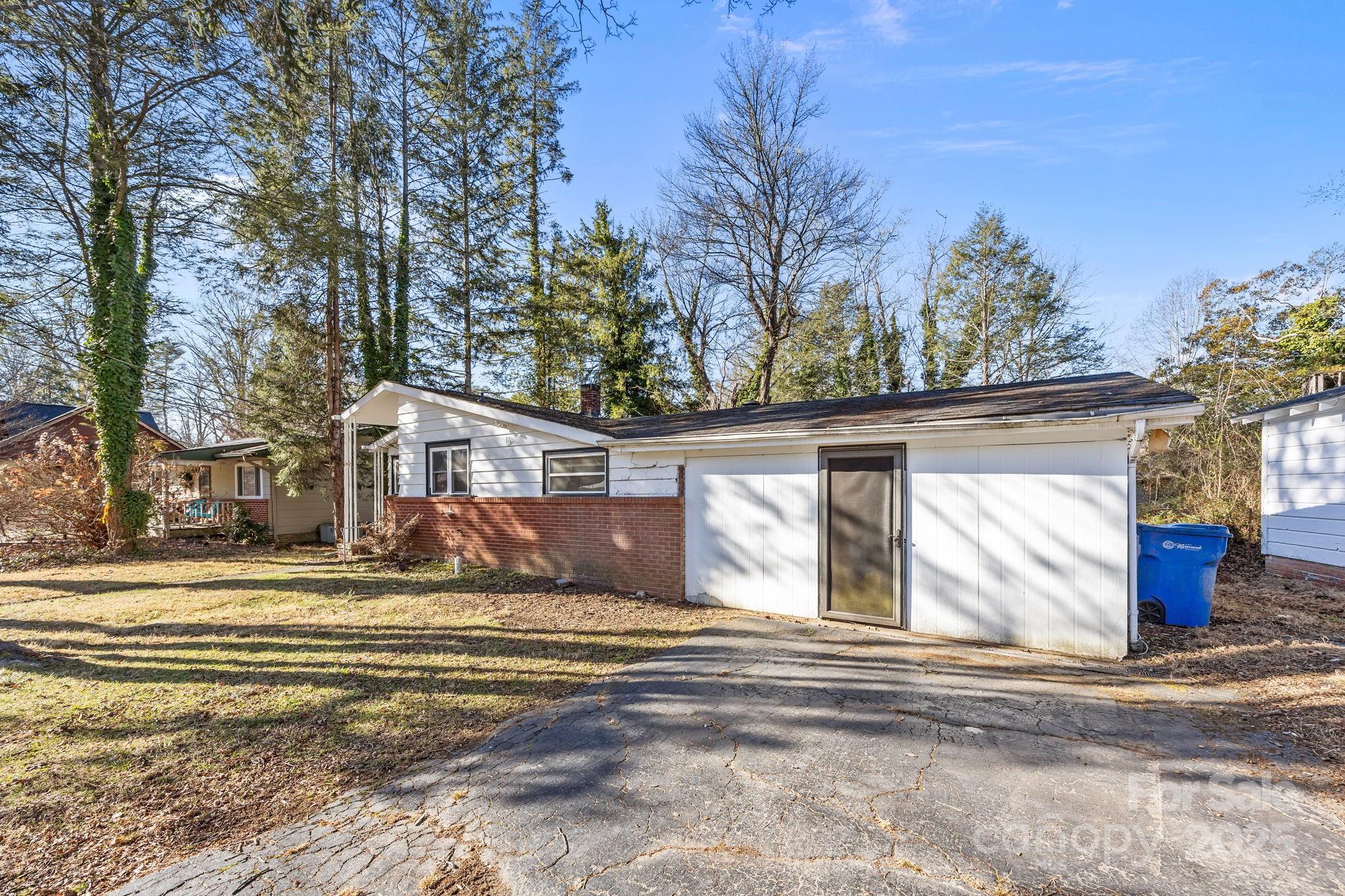 228 Grove Street Brevard, NC 28712 - Photo 6 of 44 a view of a house with a snow on the road