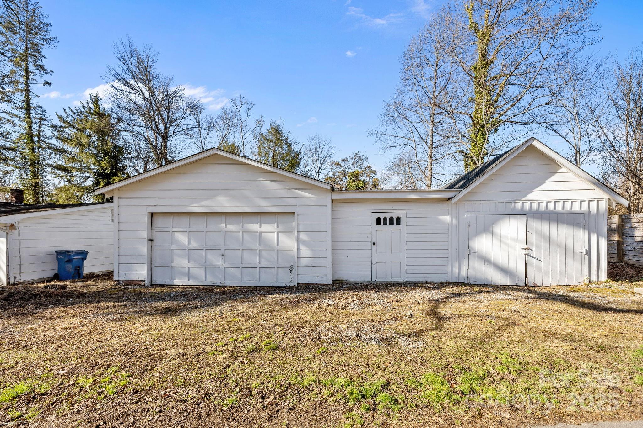 228 Grove Street Brevard, NC 28712 - Photo 9 of 44 a front view of a house with a yard