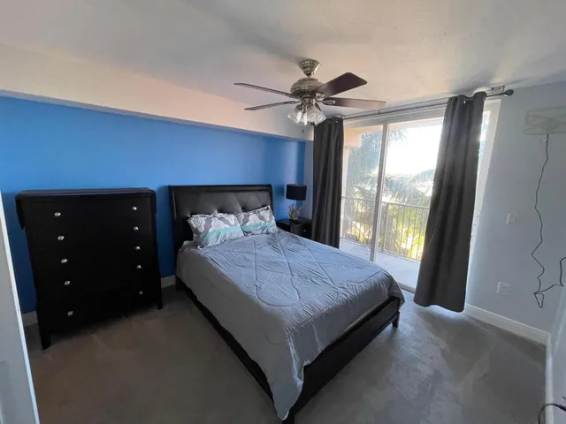 a bedroom with a bed and a closet