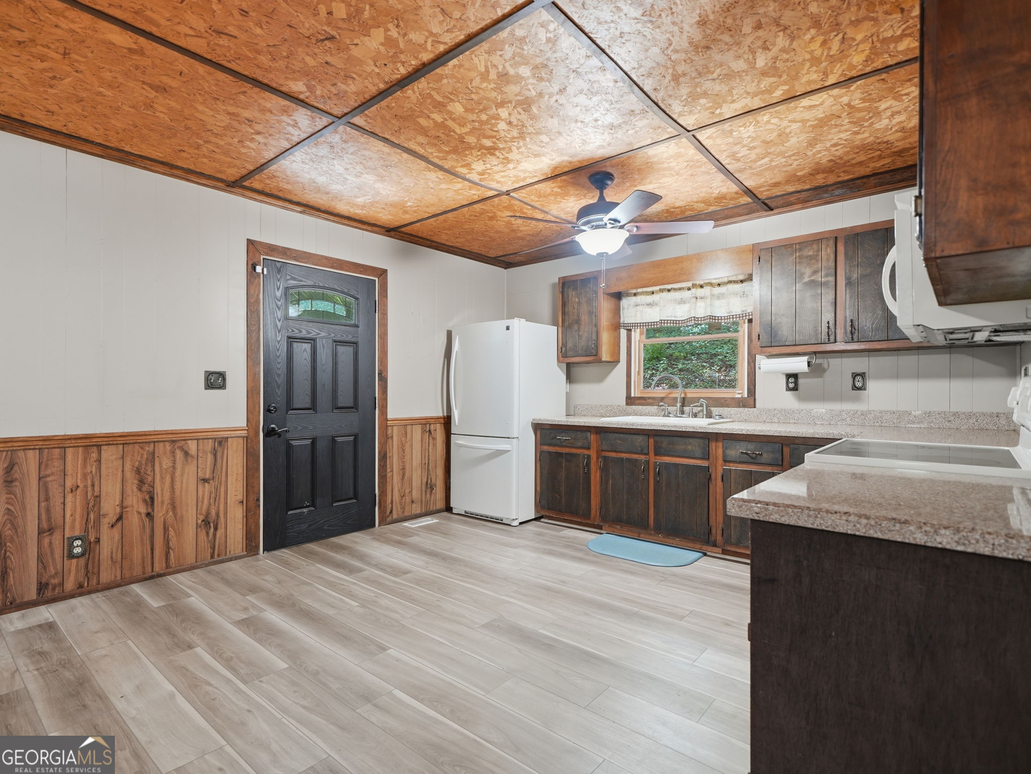 629 Goose Island Road Cherry Log, GA 30522 - Photo 8 of 52 a kitchen with stainless steel appliances kitchen island granite countertop a refrigerator and wooden cabinets