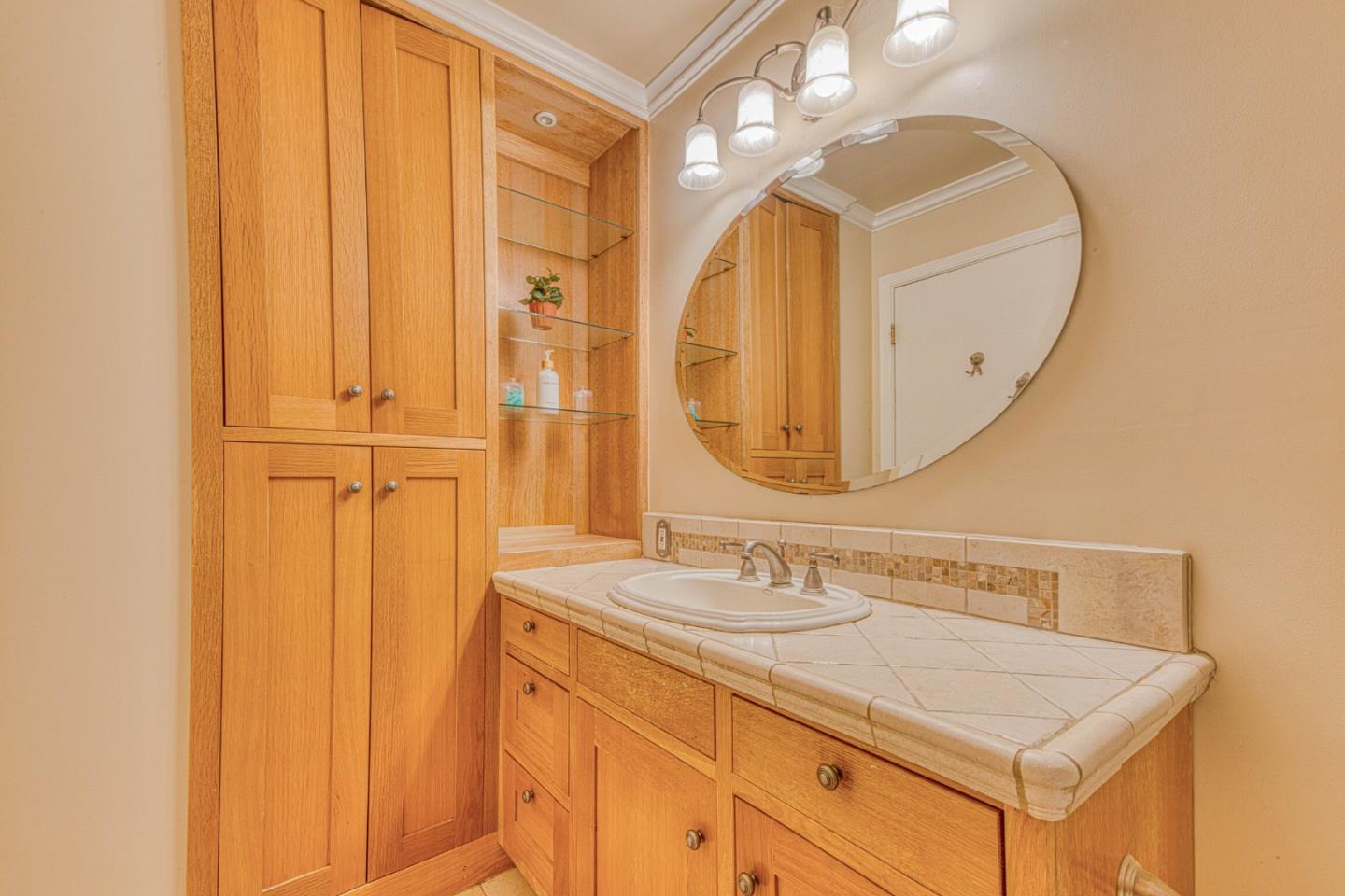 394 Mesa Road Salinas, CA 93908 - Photo 33 of 53 a bathroom with a sink vanity and a mirror