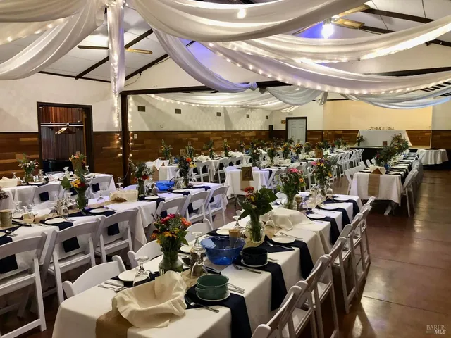 a view of a porch with a table and chairs
