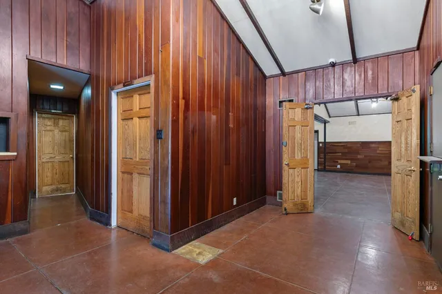 a view of a kitchen with wooden floor and a sink