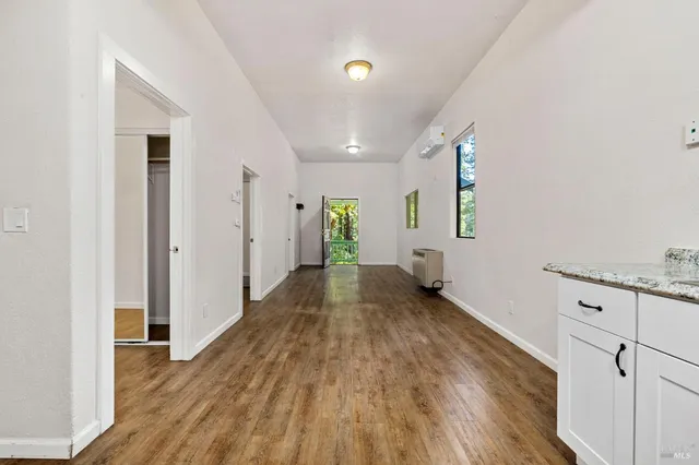 a view of a storage & utility room with wooden floor