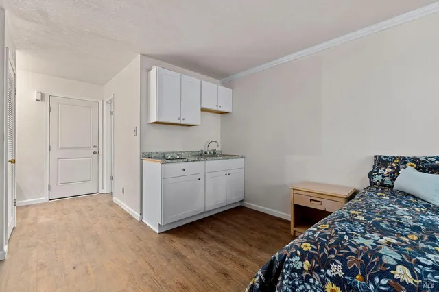 a backyard of a house with lots of green space and trees