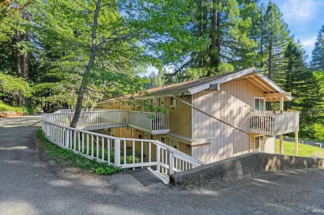 a view of balcony with wooden floor and fence