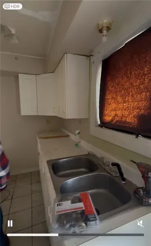 a kitchen with a sink and cabinets
