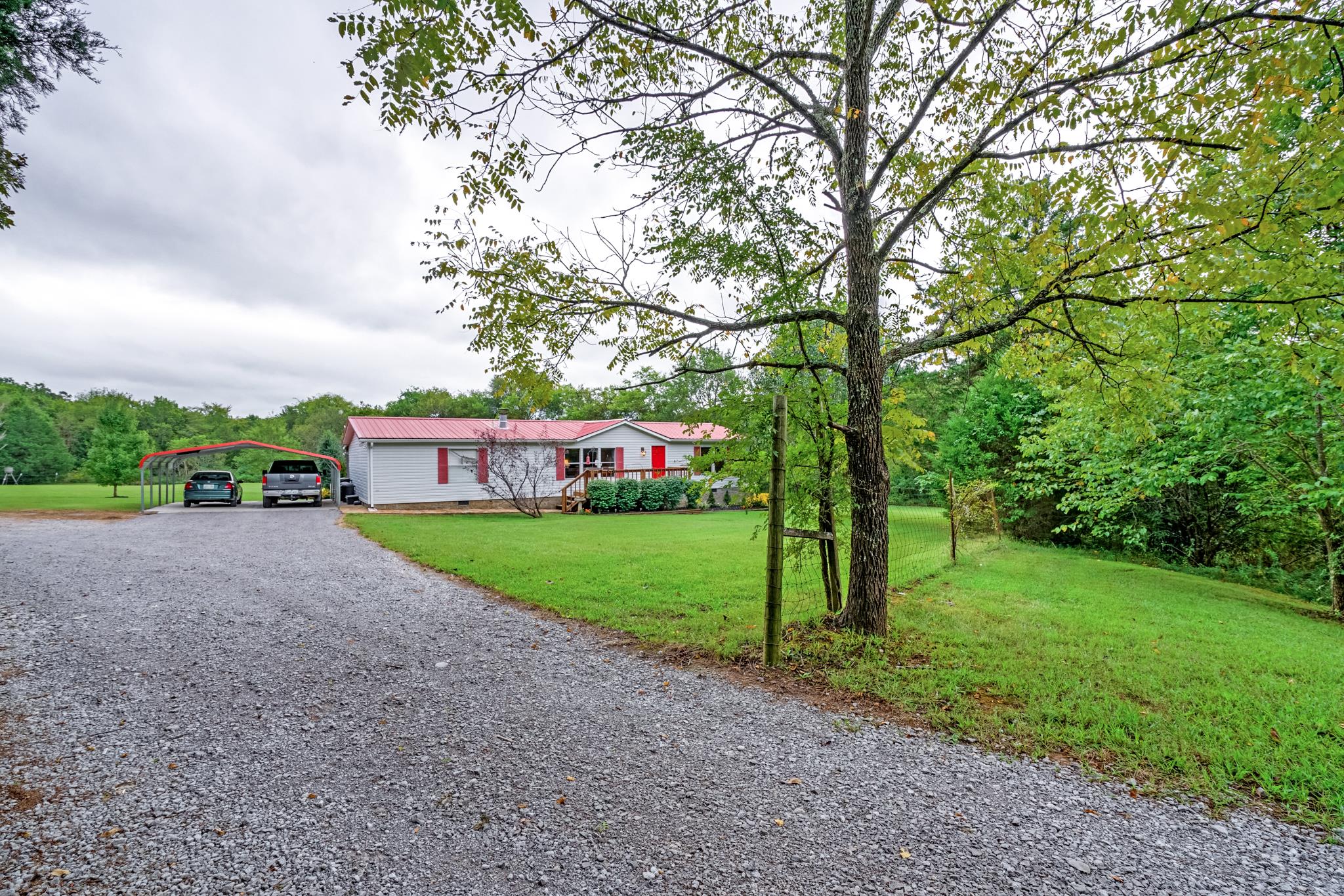 360 Tracy Road Watertown, TN 37184 - Photo 3 of 30 a view of a house with backyard and trees