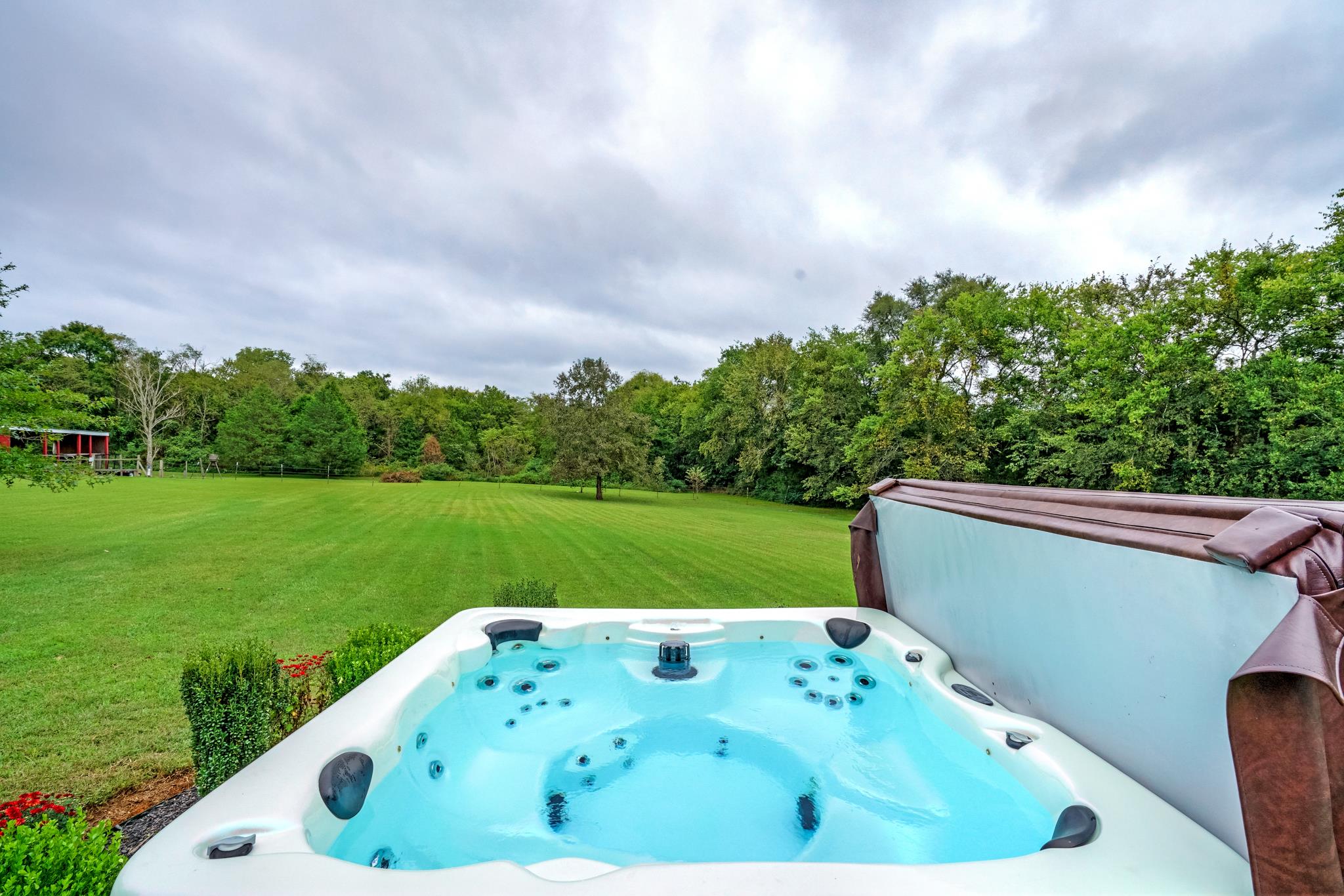 360 Tracy Road Watertown, TN 37184 - Photo 7 of 30 a view of a bathtub in a big yard with wooden fence