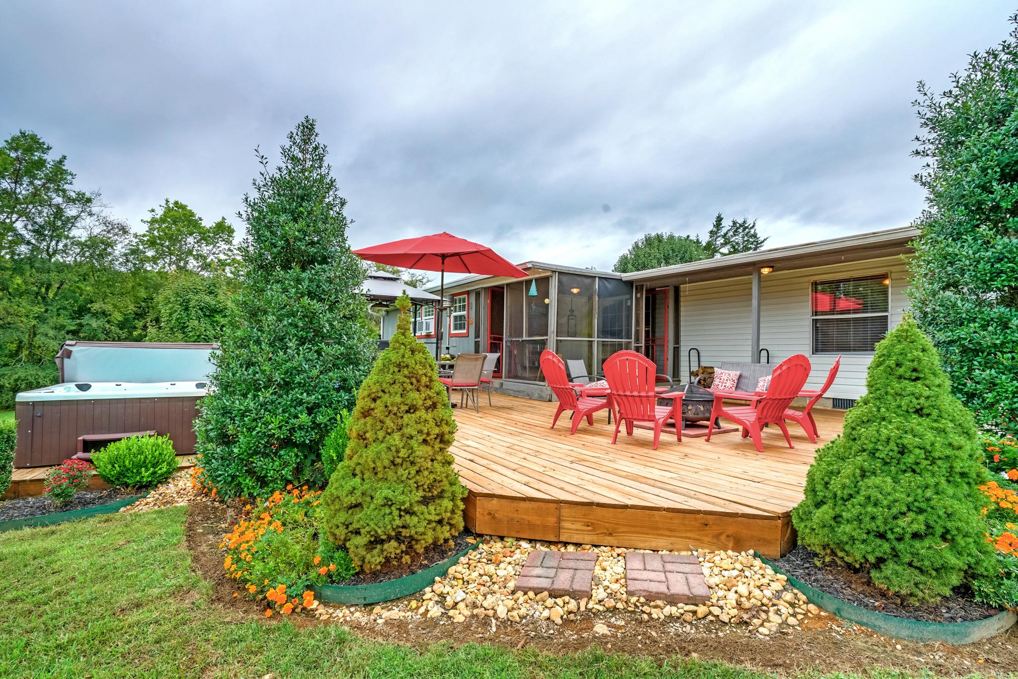 360 Tracy Road Watertown, TN 37184 - Photo 8 of 30 a view of a patio with table and chairs under an umbrella