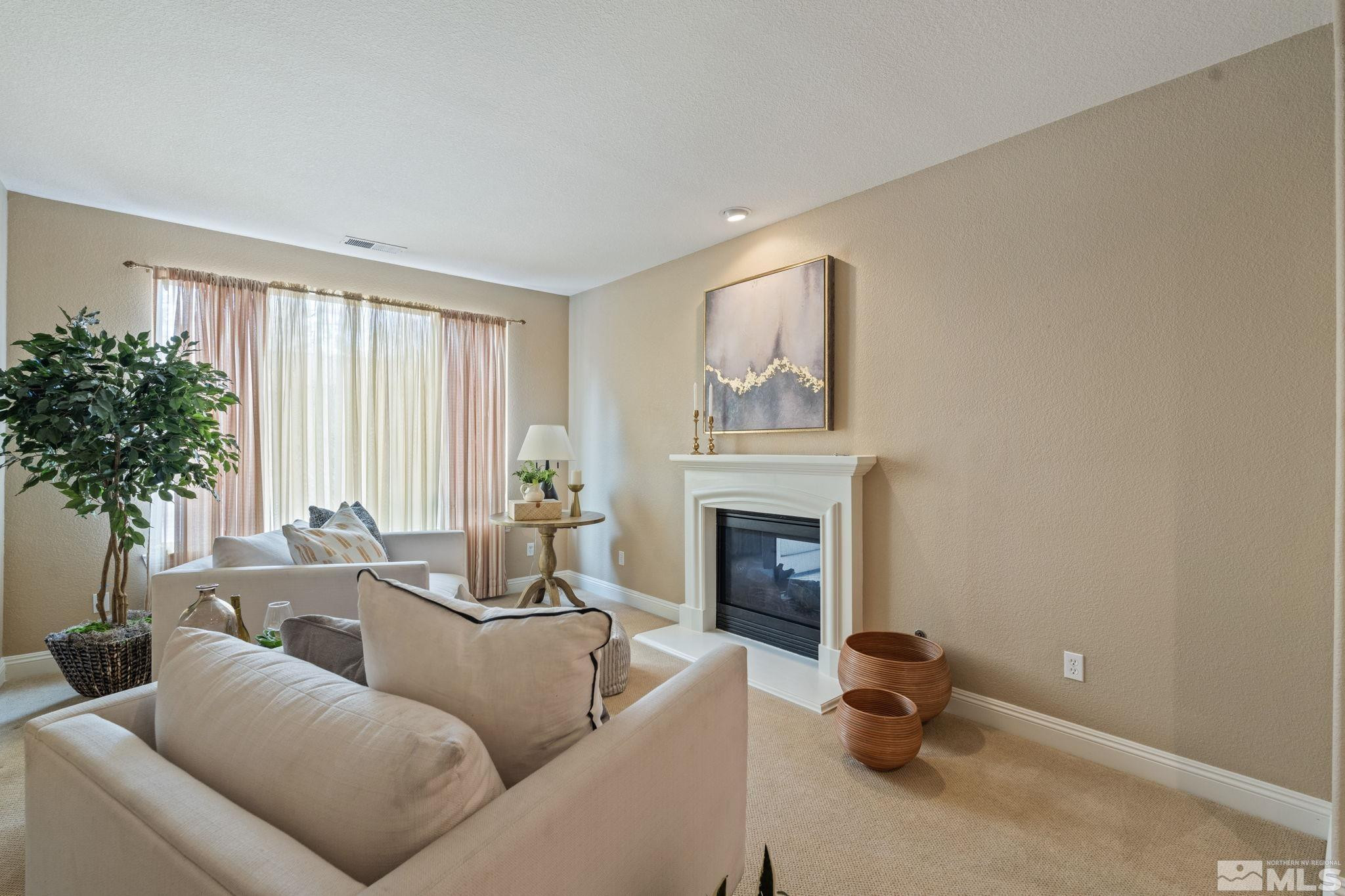 610 Aberdeen Court Reno, NV 89521 - Photo 19 of 40 a living room with furniture and a fireplace
