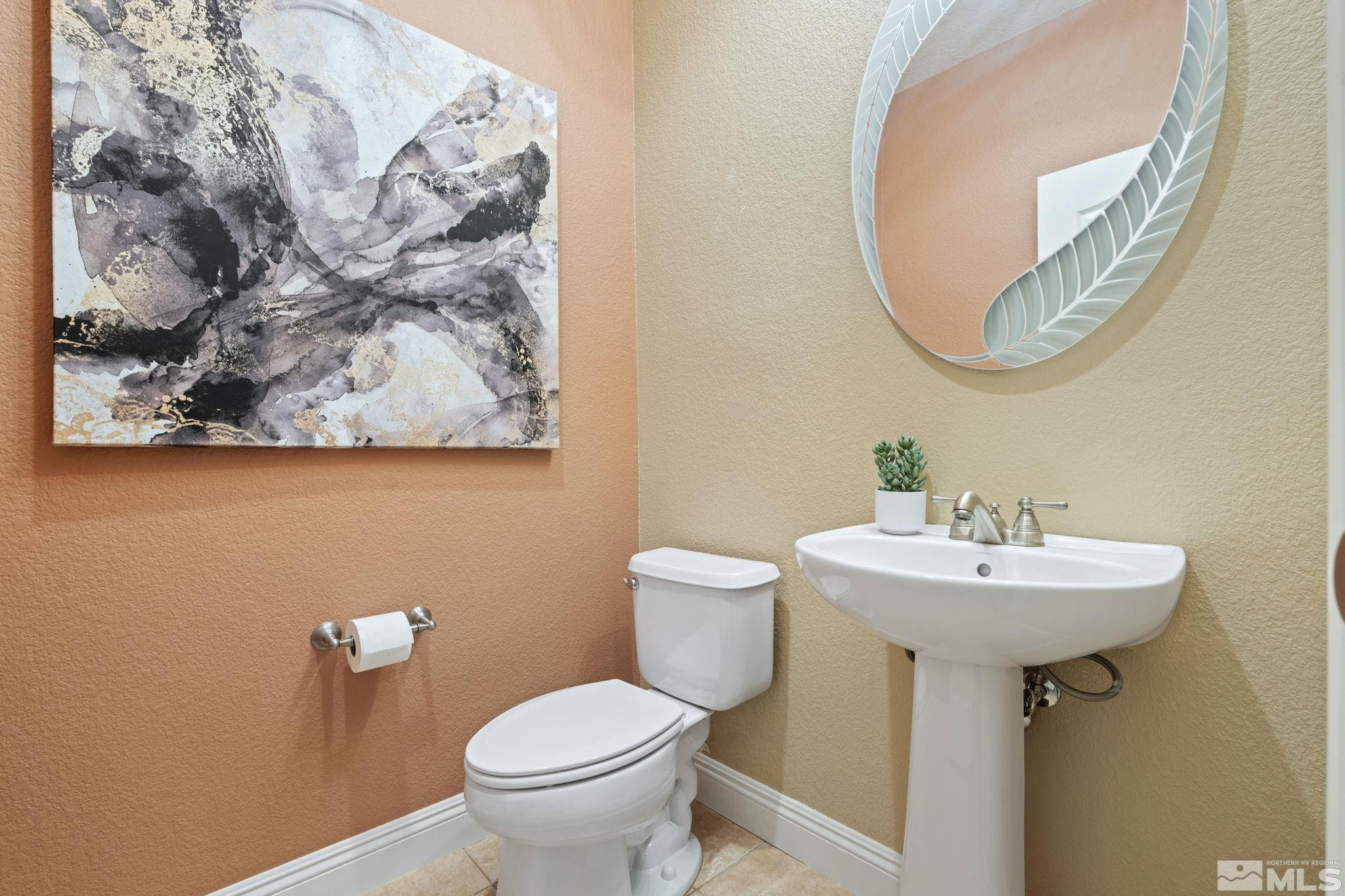 610 Aberdeen Court Reno, NV 89521 - Photo 28 of 40 a bathroom with a sink and a mirror