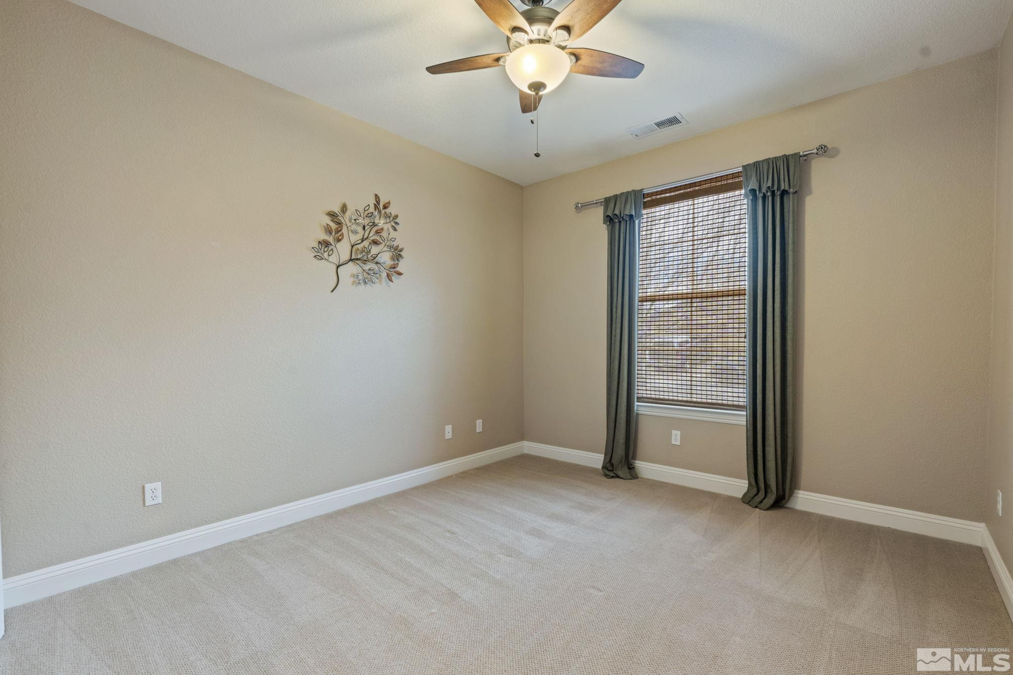 610 Aberdeen Court Reno, NV 89521 - Photo 35 of 40 an empty room with windows and fan