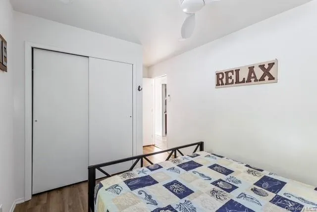 a bed room with a bed and a mirror