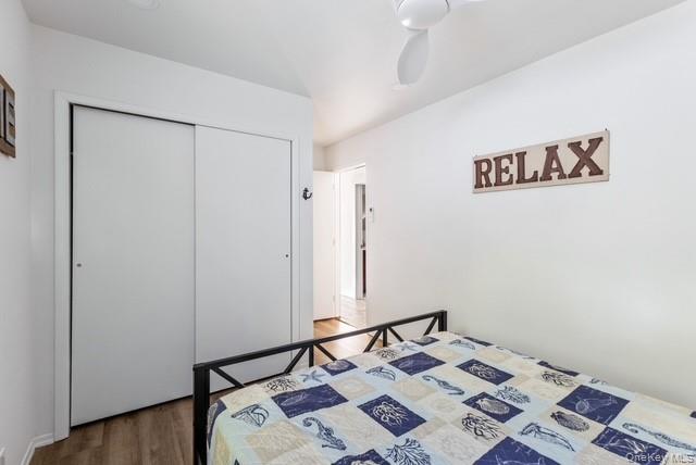 294 Wilmot Road Ocean Beach, NY 11770 - Photo 16 of 38 a bed room with a bed and a mirror