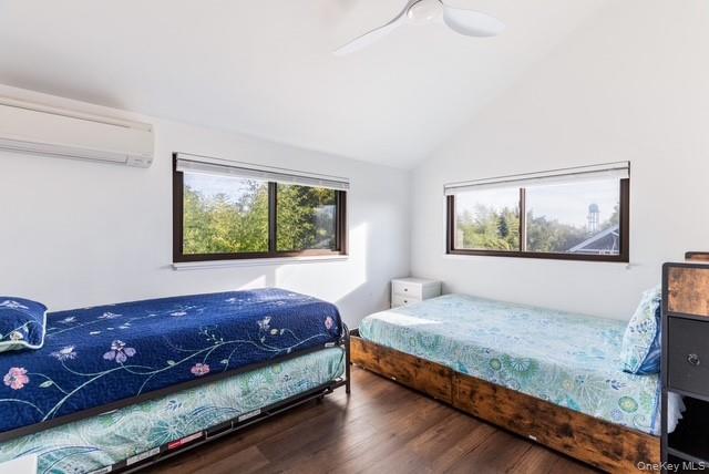 294 Wilmot Road Ocean Beach, NY 11770 - Photo 17 of 38 a bedroom with a bed and a painting on the wall