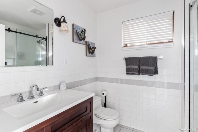 294 Wilmot Road Ocean Beach, NY 11770 - Photo 23 of 38 a bathroom with a sink toilet a mirror and shower