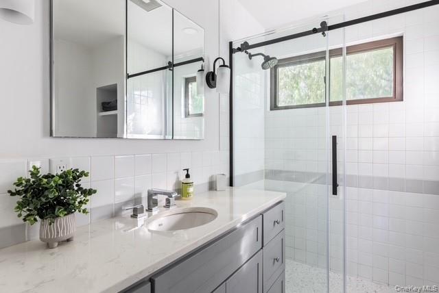 294 Wilmot Road Ocean Beach, NY 11770 - Photo 25 of 38 a bathroom with a sink and a mirror