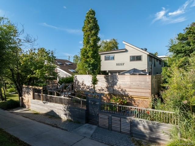 294 Wilmot Road Ocean Beach, NY 11770 - Photo 28 of 38 a front view of a house with a yard