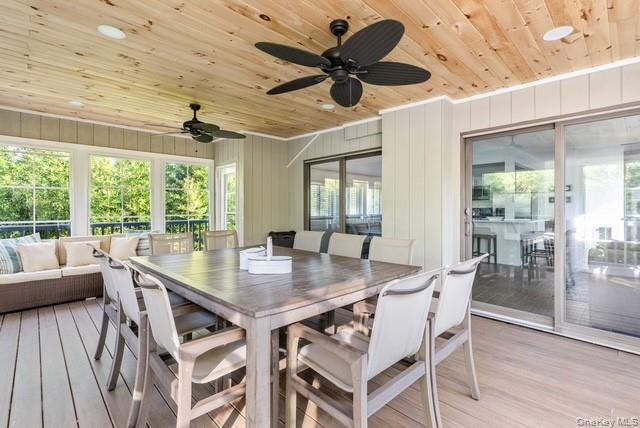 294 Wilmot Road Ocean Beach, NY 11770 - Photo 33 of 38 a view of a dining room with furniture window and wooden floor
