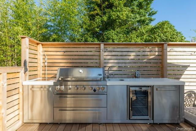 294 Wilmot Road Ocean Beach, NY 11770 - Photo 38 of 38 a view of kitchen with wooden floor and fence