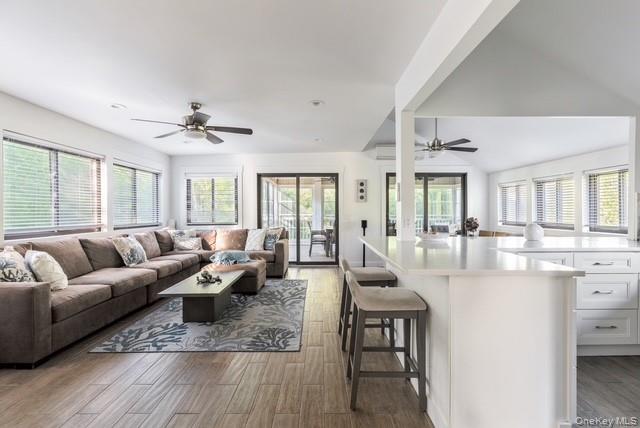294 Wilmot Road Ocean Beach, NY 11770 - Photo 6 of 38 a living room with furniture and a large window
