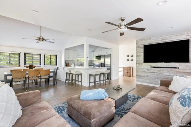 294 Wilmot Road Ocean Beach, NY 11770 - Photo 7 of 38 a living room with furniture and a flat screen tv