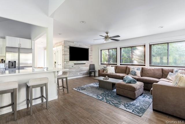294 Wilmot Road Ocean Beach, NY 11770 - Photo 8 of 38 a living room with furniture and a flat screen tv