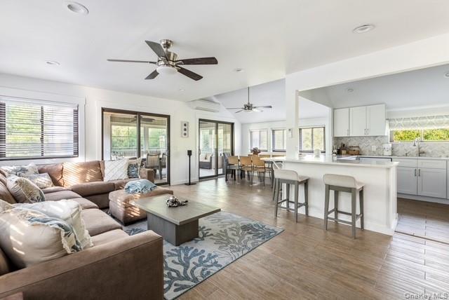 294 Wilmot Road Ocean Beach, NY 11770 - Photo 9 of 38 a living room with furniture and a large window