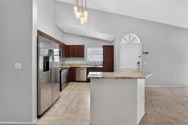 a view of a hallway with a chandelier