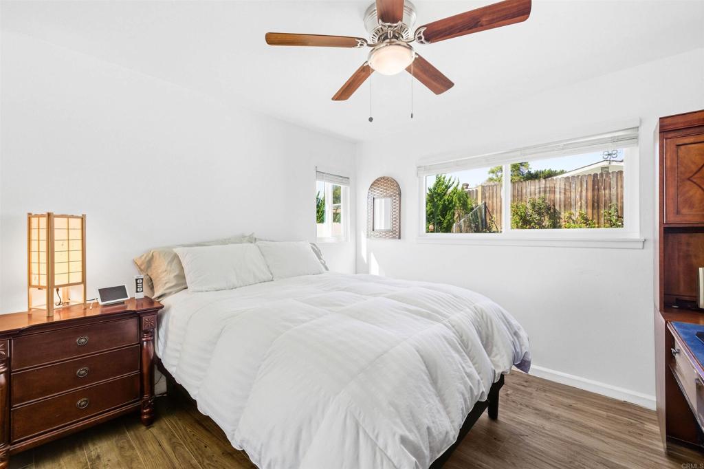 3560 Santa Maria Street Oceanside, CA 92056 - Photo 20 of 40 a bedroom with a bed and wooden floor