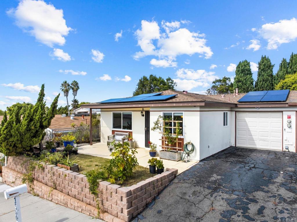 3560 Santa Maria Street Oceanside, CA 92056 - Photo 2 of 40 a front view of a house with a yard and potted plants