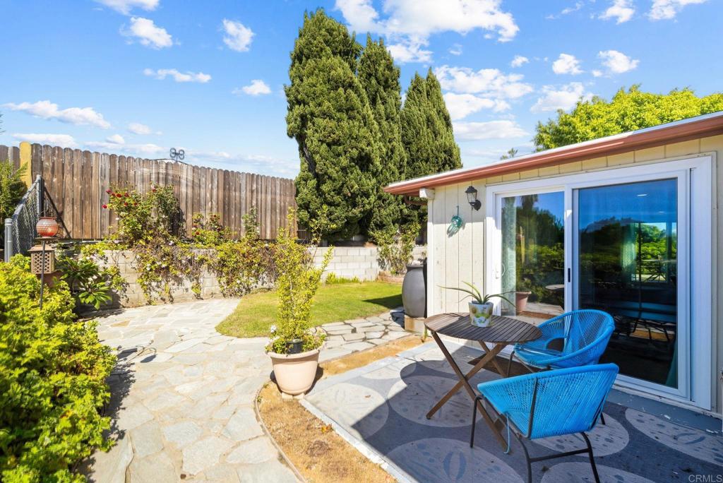 3560 Santa Maria Street Oceanside, CA 92056 - Photo 38 of 40 a view of a patio with table and chairs and potted plants