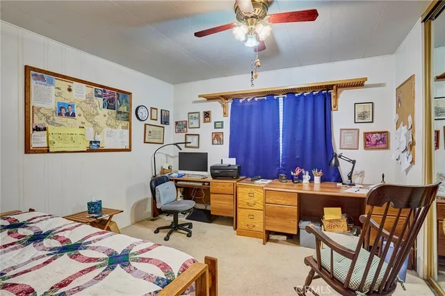 a workspace with furniture and chandelier