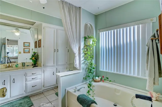 a bathroom with a bathtub and a sink