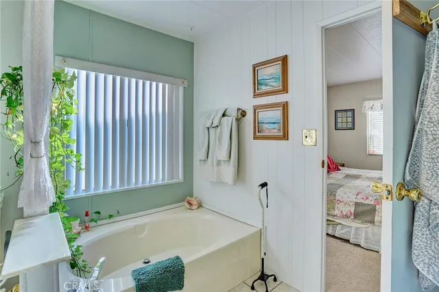 a bathroom with a bathtub and a sink