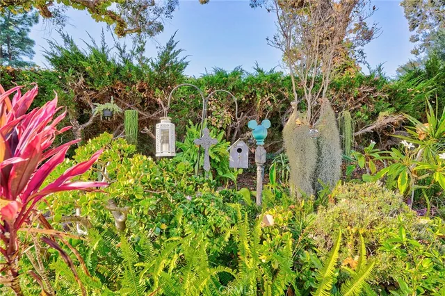 a view of a patio with a table and chairs under an umbrella