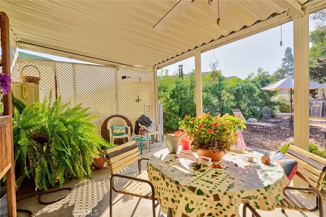 a view of a house with a big yard and large trees