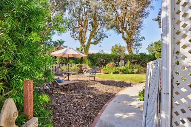 a view of a house with large garden and plants