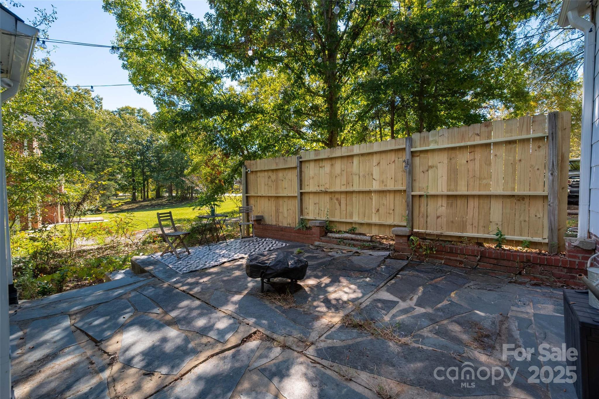 900 Chesterfield Avenue Lancaster, SC 29720 - Photo 28 of 37 a view of a backyard with wooden fence