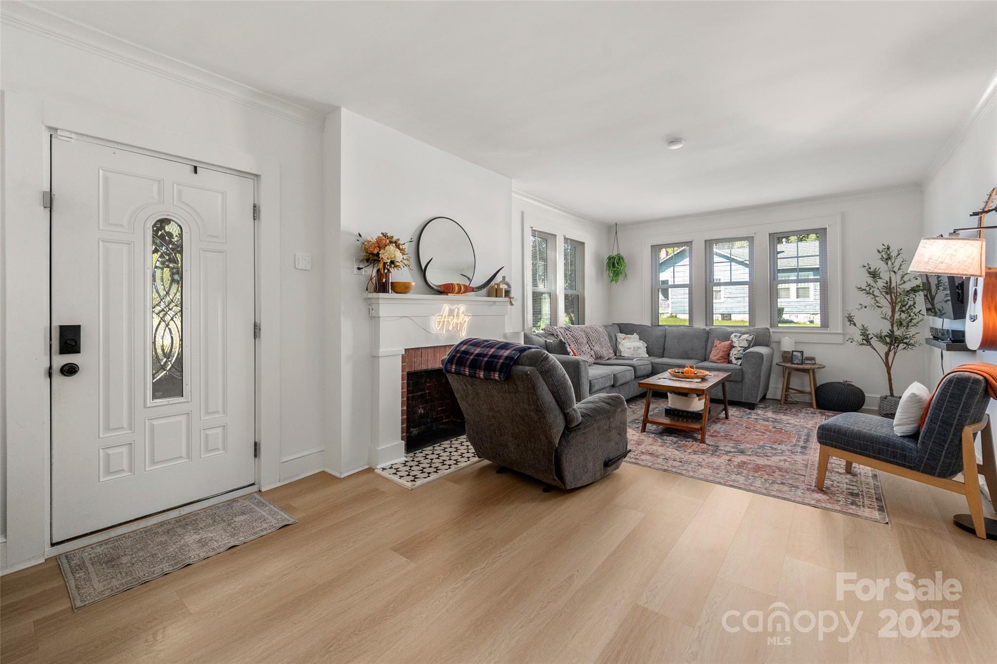 900 Chesterfield Avenue Lancaster, SC 29720 - Photo 4 of 37 a living room with furniture a ceiling fan and a window